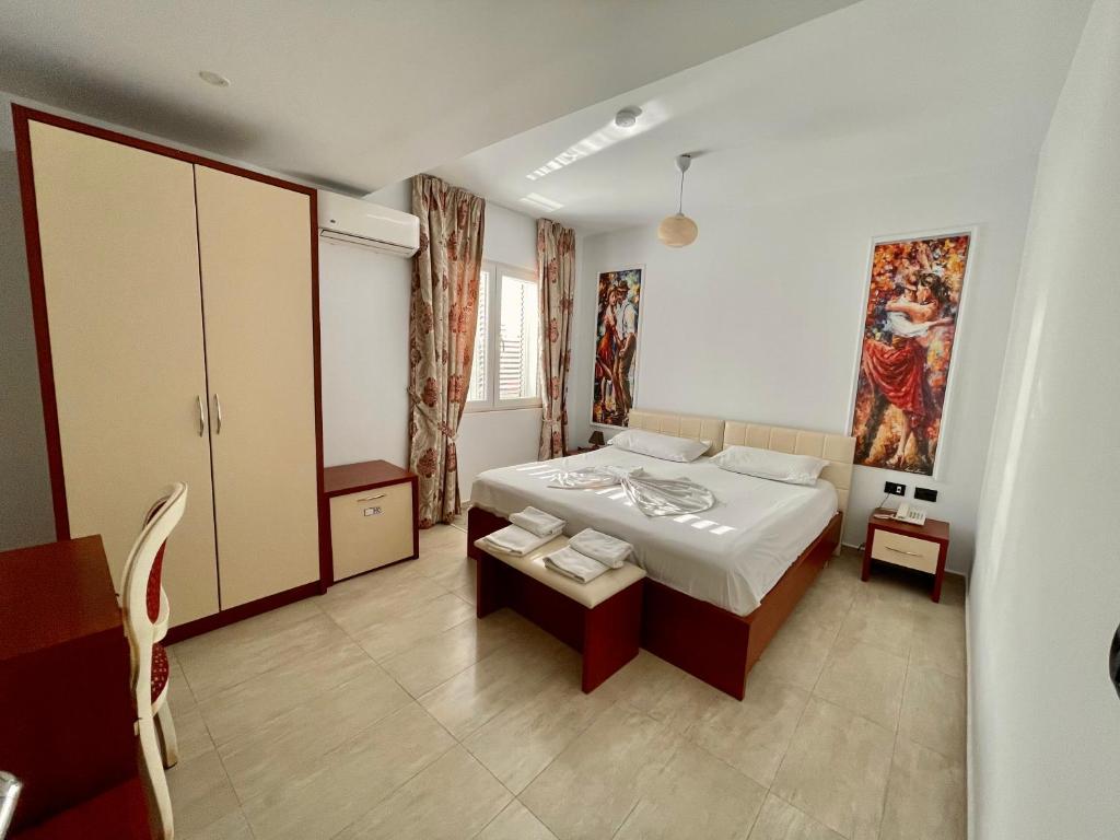 Postel nebo postele na pokoji v ubytování Vila Ada Hotel