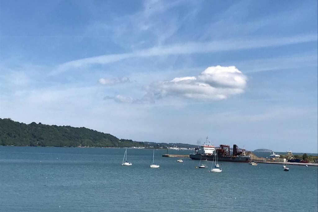 a group of boats in a large body of water at Spectacular 4 Bedroom Sea View Residential Home in Bangor