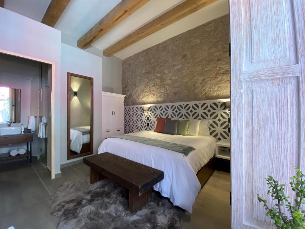 Postel nebo postele na pokoji v ubytování Hotel Casa Once