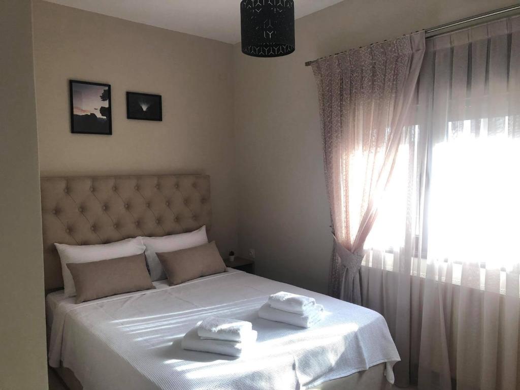 Postel nebo postele na pokoji v ubytování Zillis Apartments