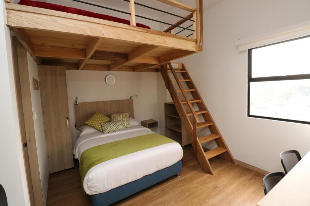 Postel nebo postele na pokoji v ubytování Normandía Tower