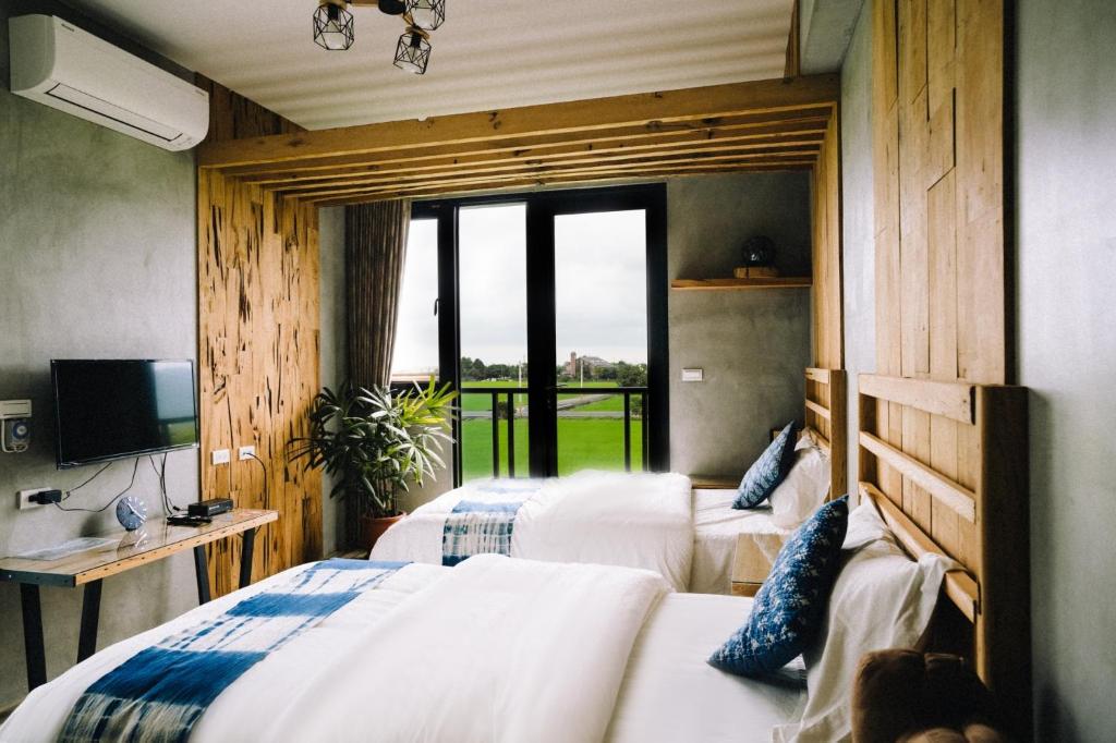 Postel nebo postele na pokoji v ubytování 似禾苑民宿 Siheyuan Homestay