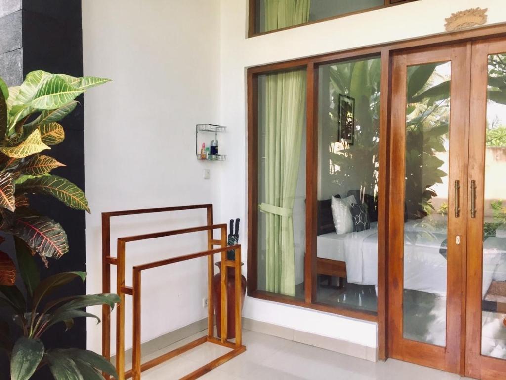 Postel nebo postele na pokoji v ubytování Bali Sila Bisma