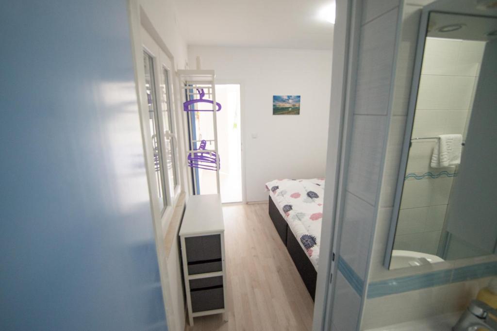 Postel nebo postele na pokoji v ubytování Apartment SunSet Dubrovnik FREE PARKING & WIFI