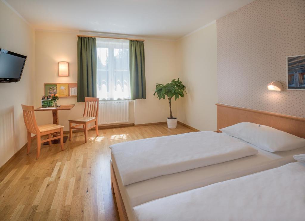 Postel nebo postele na pokoji v ubytování JUFA Hotel Altaussee