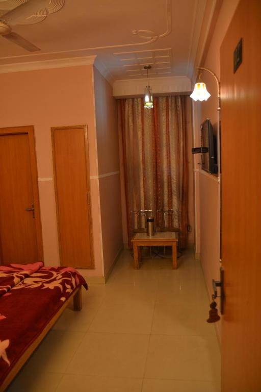 Postel nebo postele na pokoji v ubytování Hotel Queen