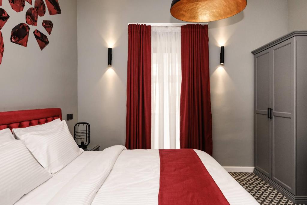 Postel nebo postele na pokoji v ubytování Casa Reale Boutique Hotel