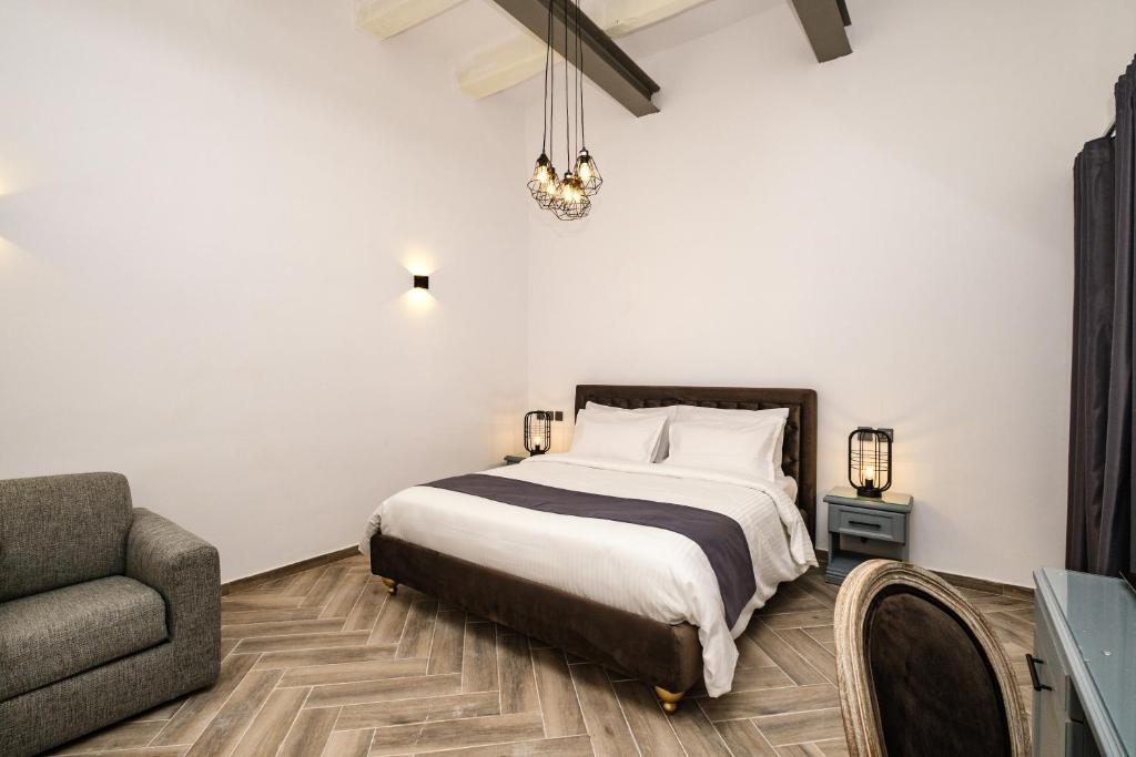 Postel nebo postele na pokoji v ubytování Casa Reale Boutique Hotel
