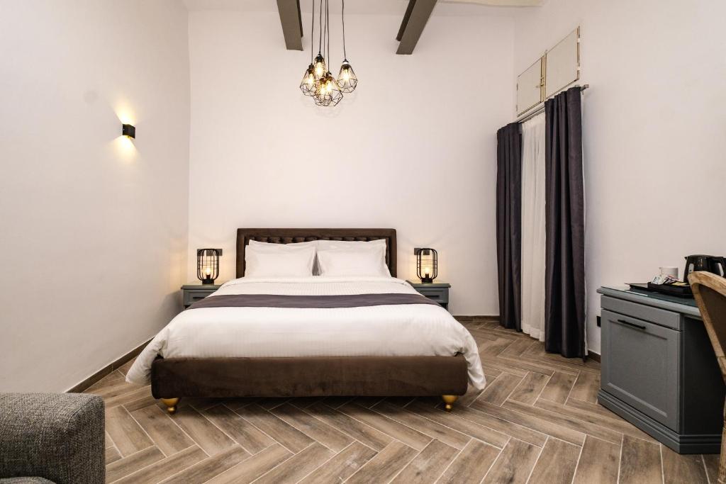 Postel nebo postele na pokoji v ubytování Casa Reale Boutique Hotel
