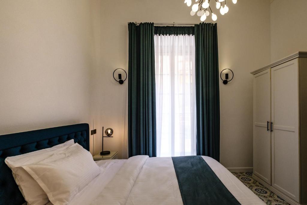 Кровать или кровати в номере Casa Reale Boutique Hotel