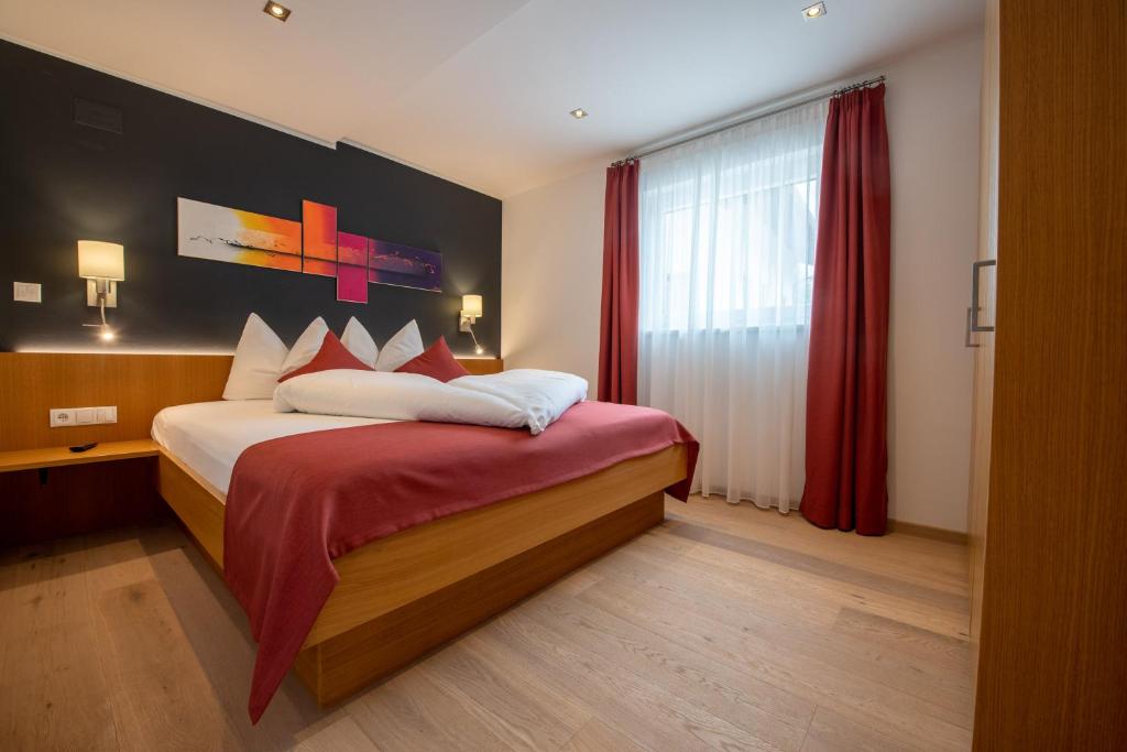 Postel nebo postele na pokoji v ubytování Lapis Monti - Apartments & Suites