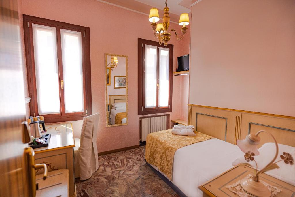 Postel nebo postele na pokoji v ubytování Hotel Al Piave