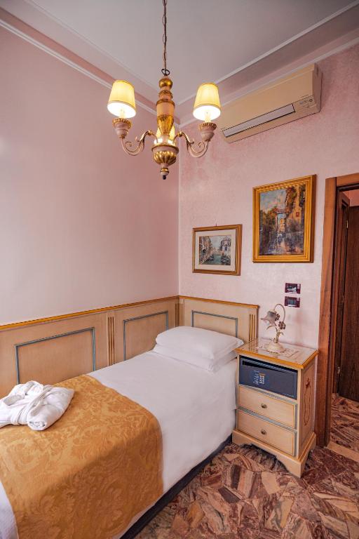 Postel nebo postele na pokoji v ubytování Hotel Al Piave