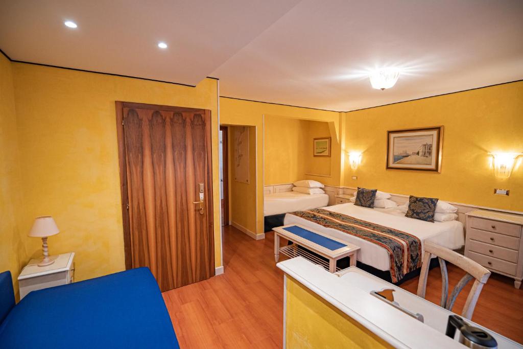 Postel nebo postele na pokoji v ubytování Hotel Al Piave