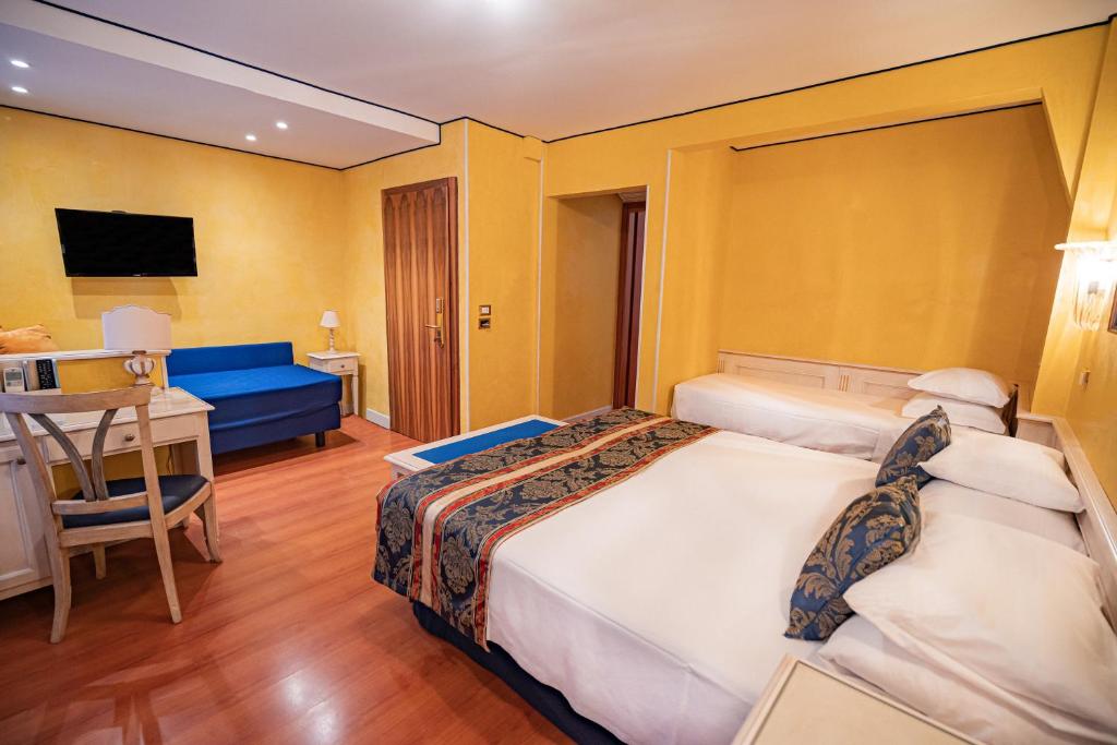 Postel nebo postele na pokoji v ubytování Hotel Al Piave