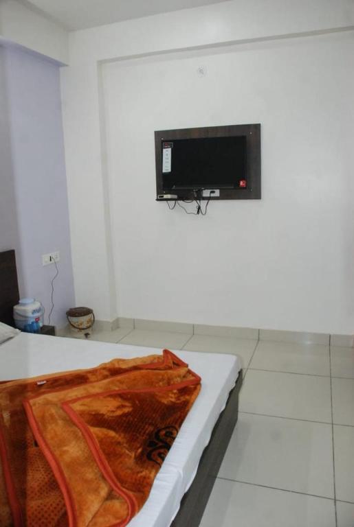 Postel nebo postele na pokoji v ubytování Hotel Chouhan Paradise