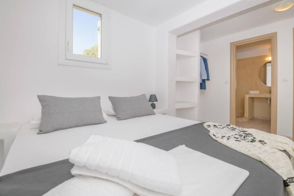 Postel nebo postele na pokoji v ubytování Magginas Residence