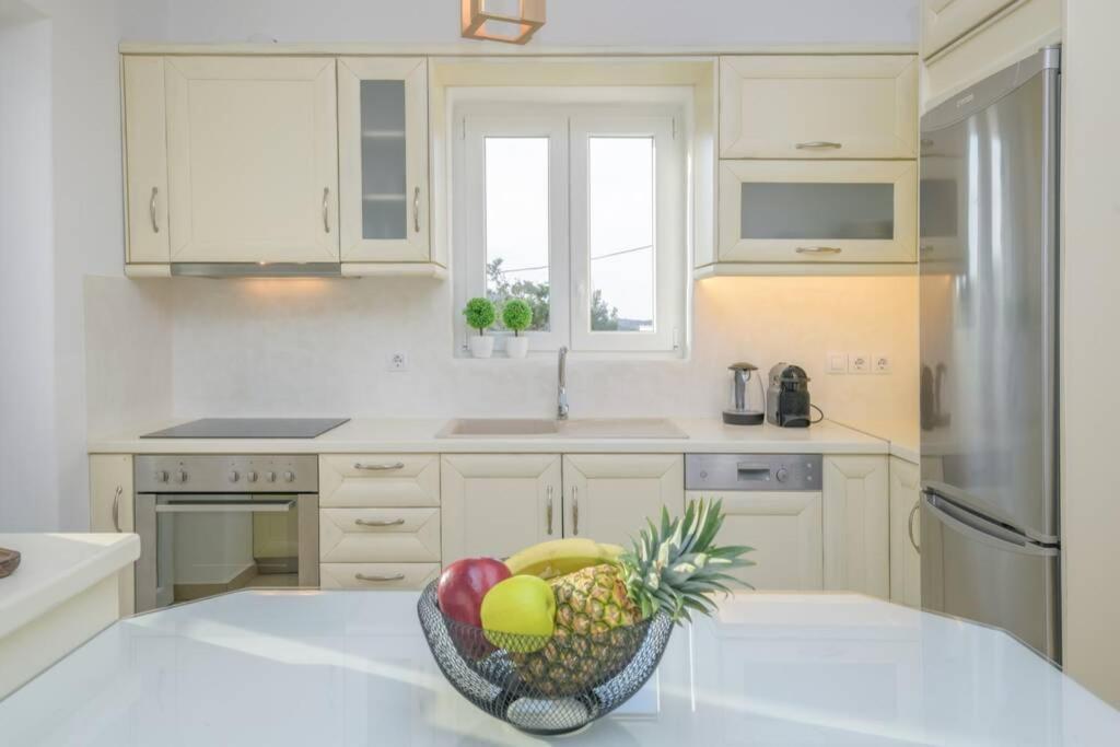 Kuchyň nebo kuchyňský kout v ubytování Magginas Residence