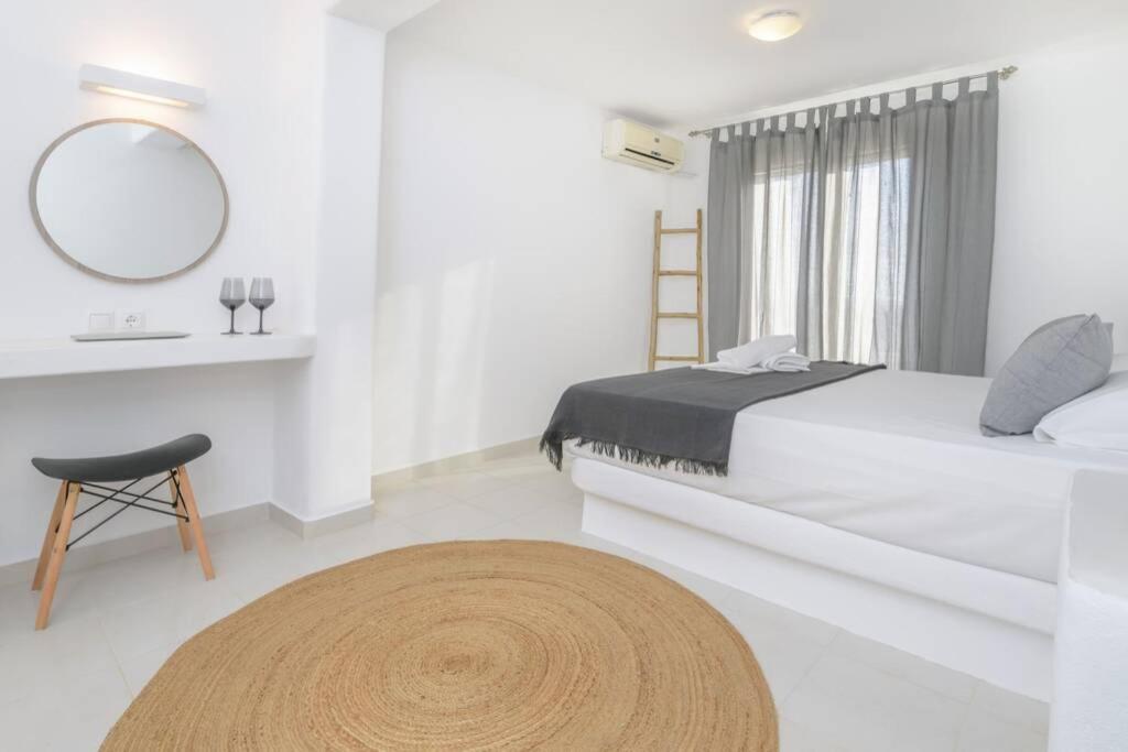 Postel nebo postele na pokoji v ubytování Magginas Residence