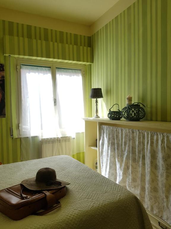 Postel nebo postele na pokoji v ubytování Dimora in Francigena