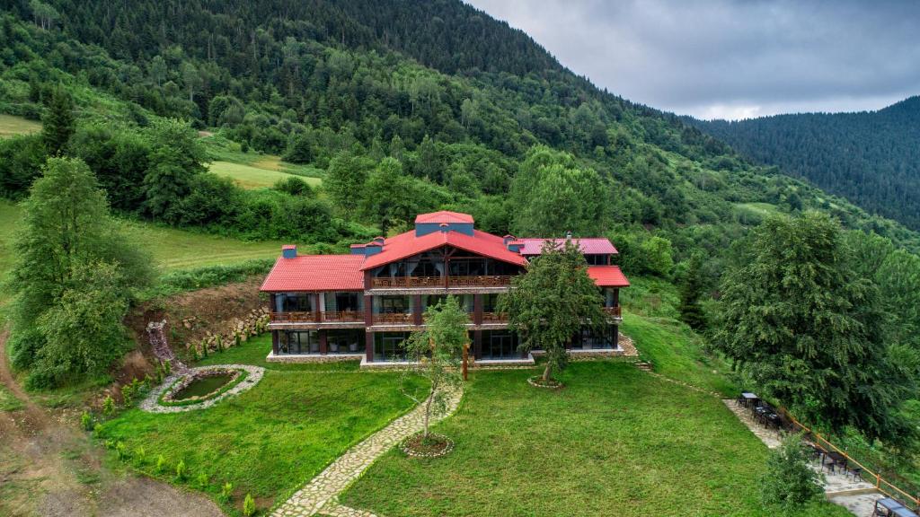 an aerial view of a large house in the mountains at İspendam Tess Otel in Macka