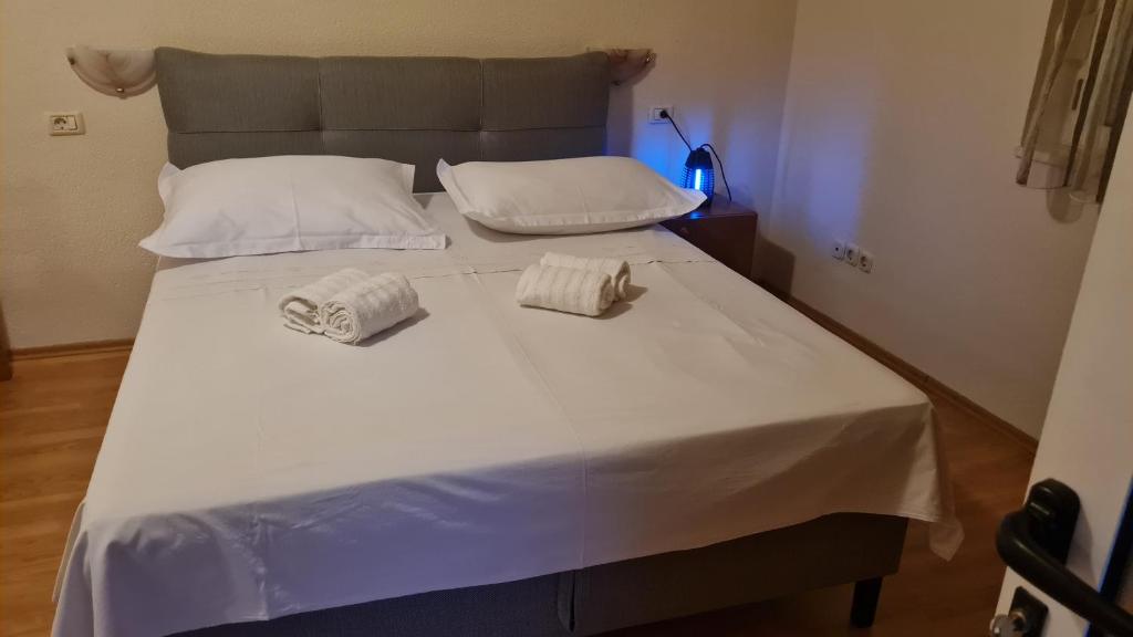 Posteľ alebo postele v izbe v ubytovaní Apartments Prižmić