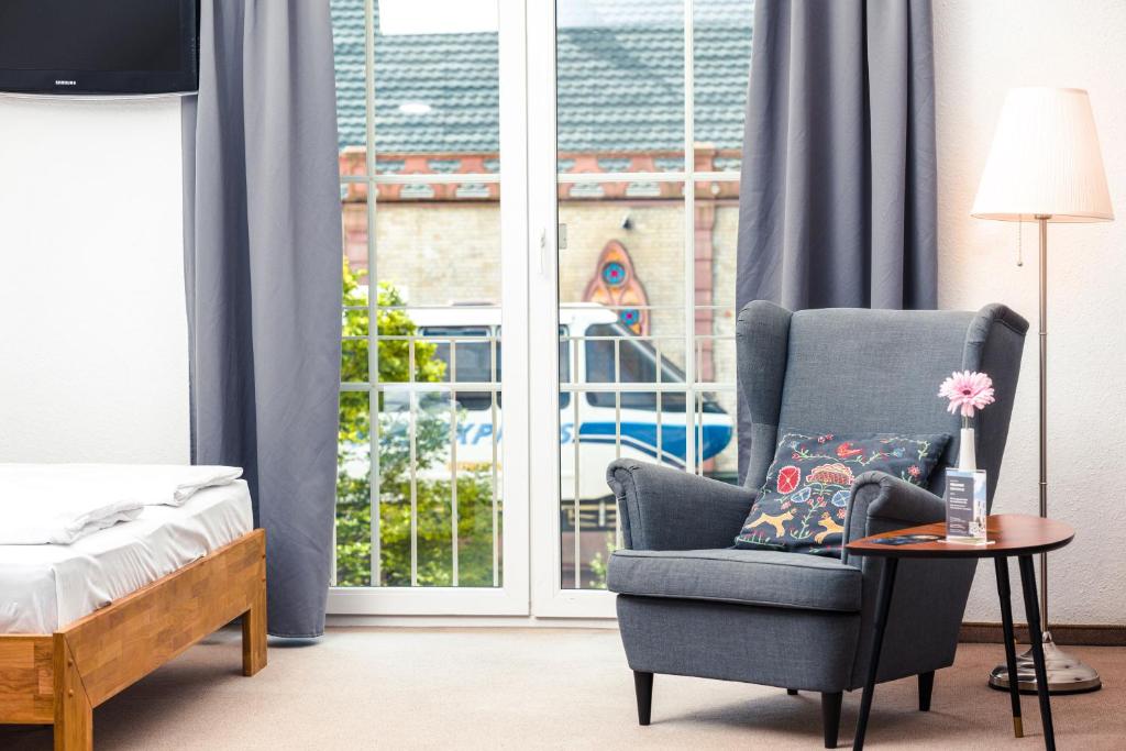 Postel nebo postele na pokoji v ubytování Hotel am Park