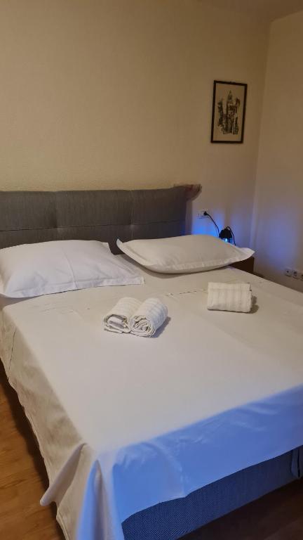 Posteľ alebo postele v izbe v ubytovaní Apartments Prižmić