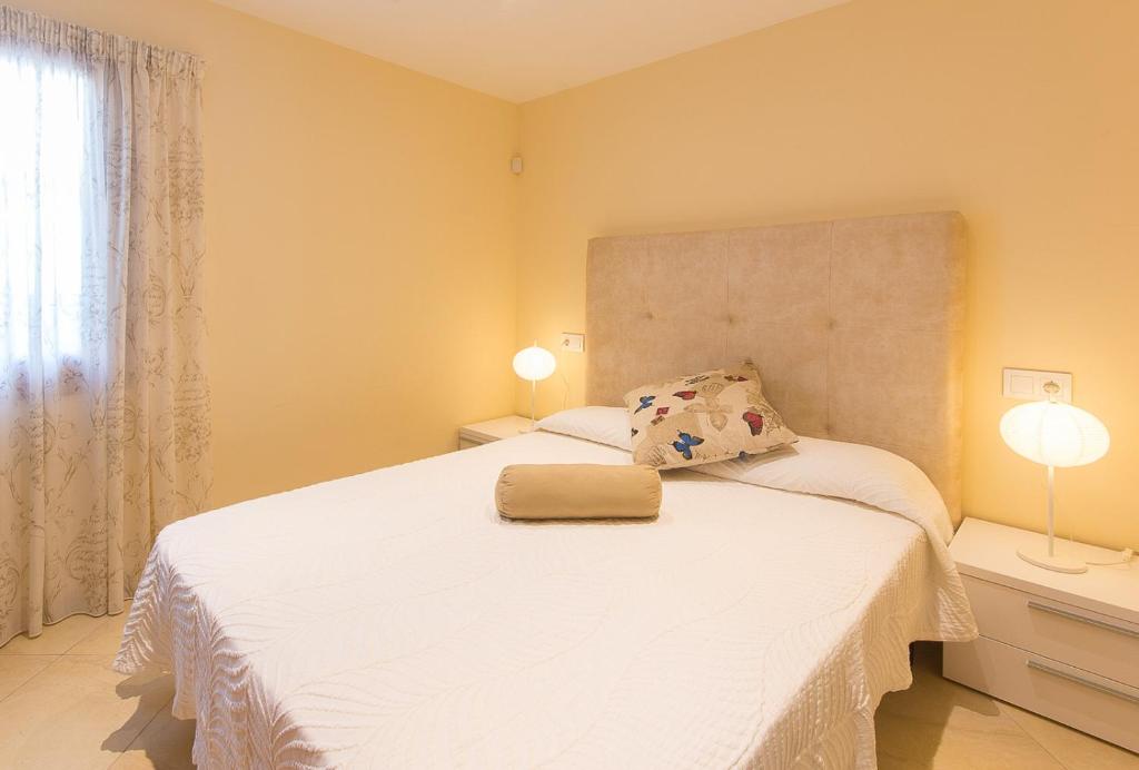 Postel nebo postele na pokoji v ubytování Casa de los Pinos