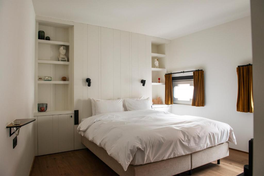 Postel nebo postele na pokoji v ubytování Hotel Riga