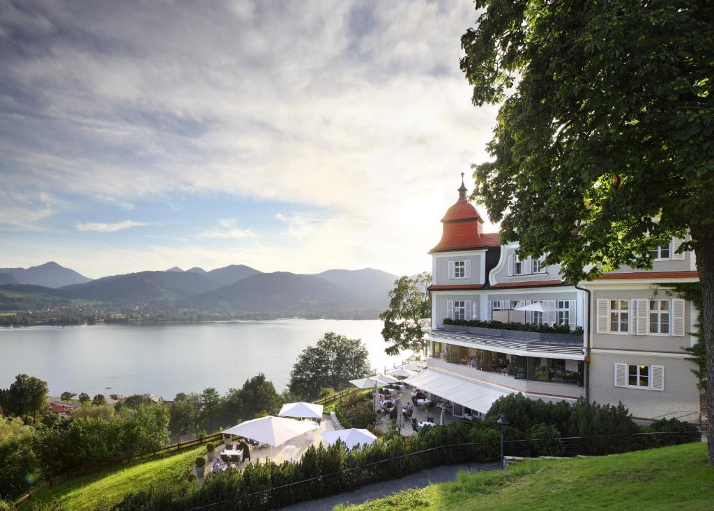 a hotel with a view of a lake at Das Tegernsee in Tegernsee