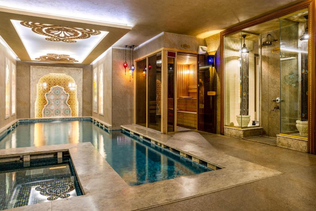 a large swimming pool in a house at Romance Istanbul Hotel Boutique Class in Istanbul