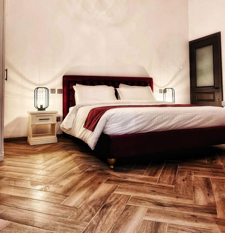 Postel nebo postele na pokoji v ubytování Casa Reale Boutique Hotel