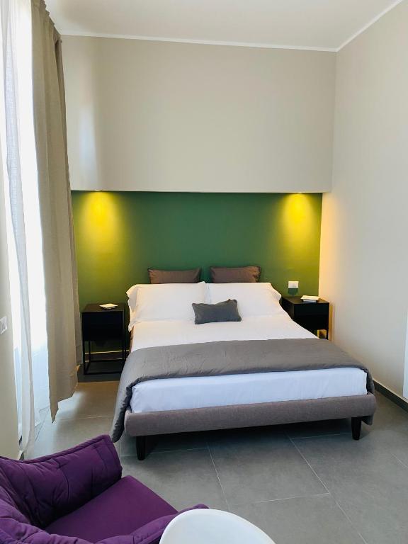 A bed or beds in a room at Catania Rooms