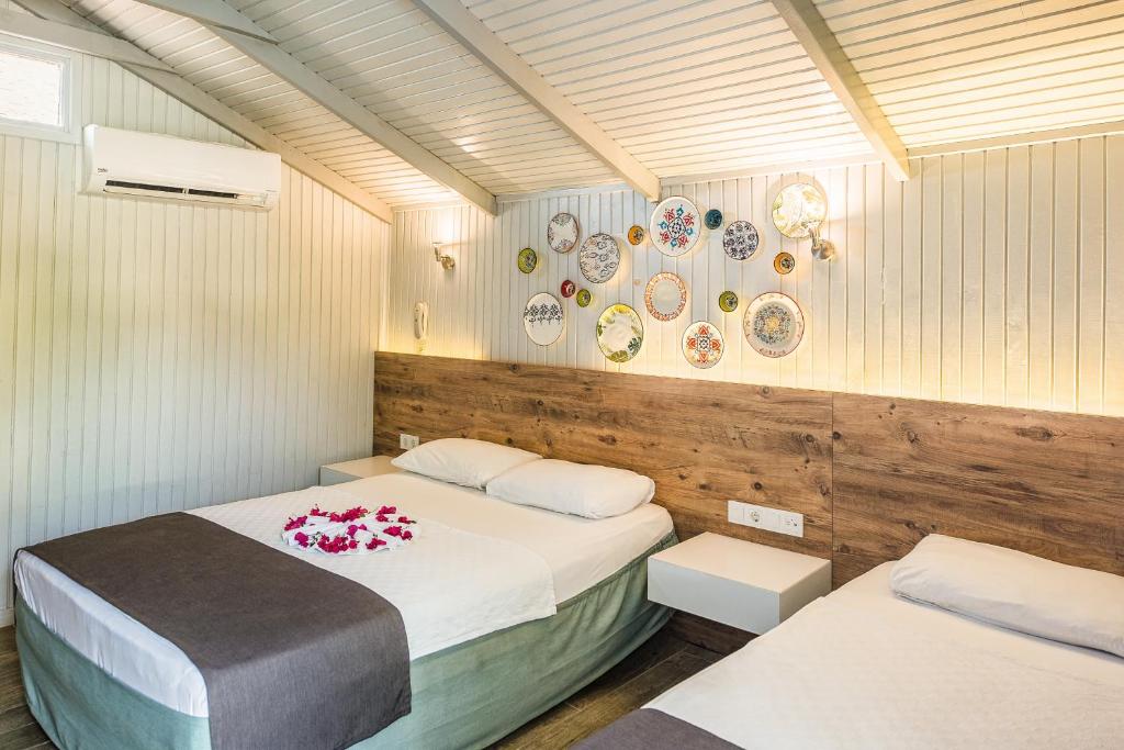 Postel nebo postele na pokoji v ubytování Leda Beach Hotel