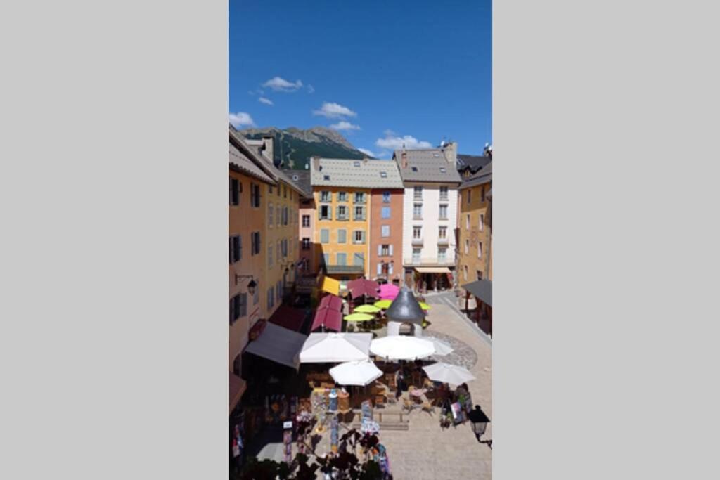 an overhead view of a market in a town at Appartement de charme le 1707 au cœur de la cité Vauban in Briançon
