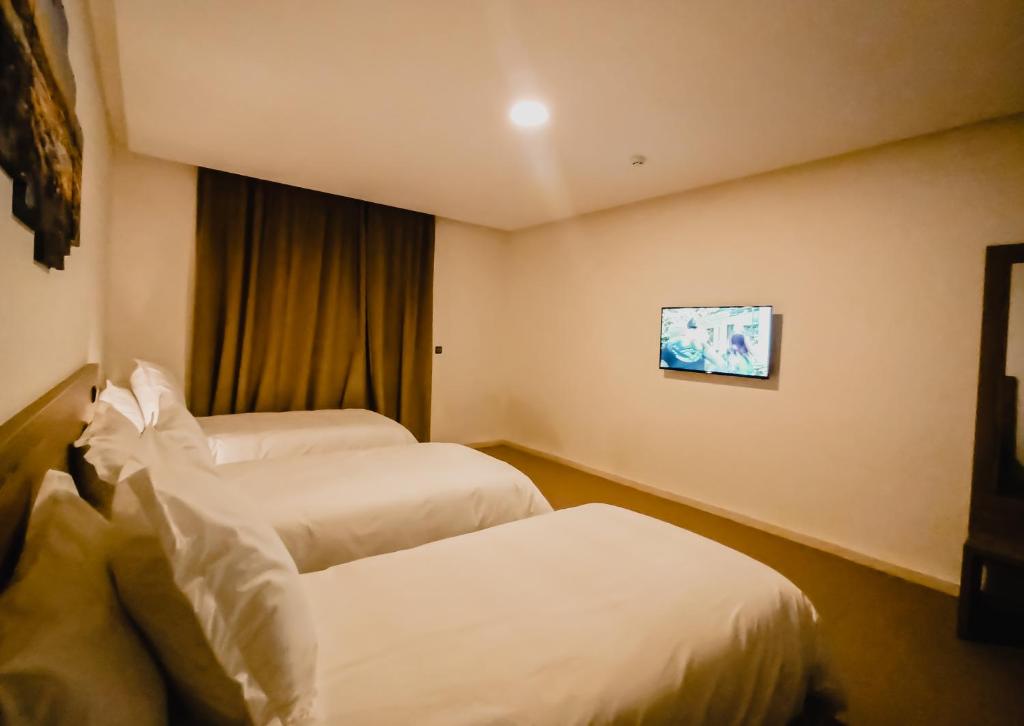 Postel nebo postele na pokoji v ubytování EL MOUSSAFIR HOTEL