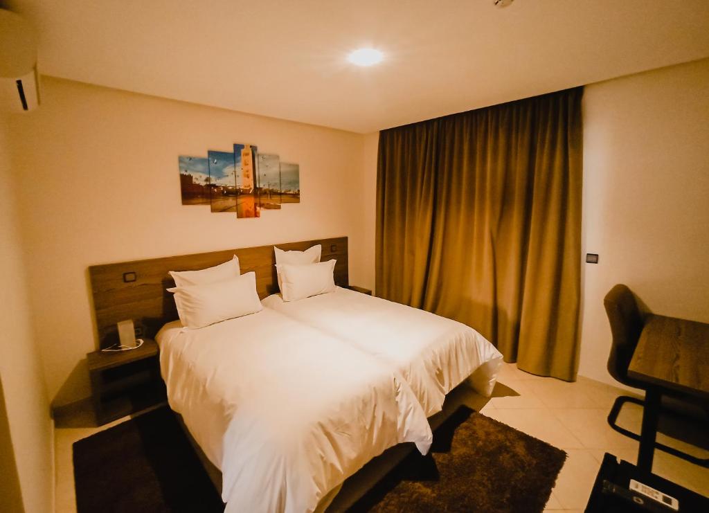 Postel nebo postele na pokoji v ubytování EL MOUSSAFIR HOTEL
