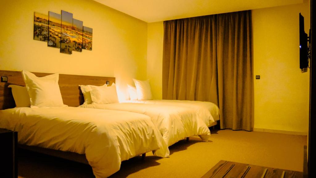 Postel nebo postele na pokoji v ubytování EL MOUSSAFIR HOTEL