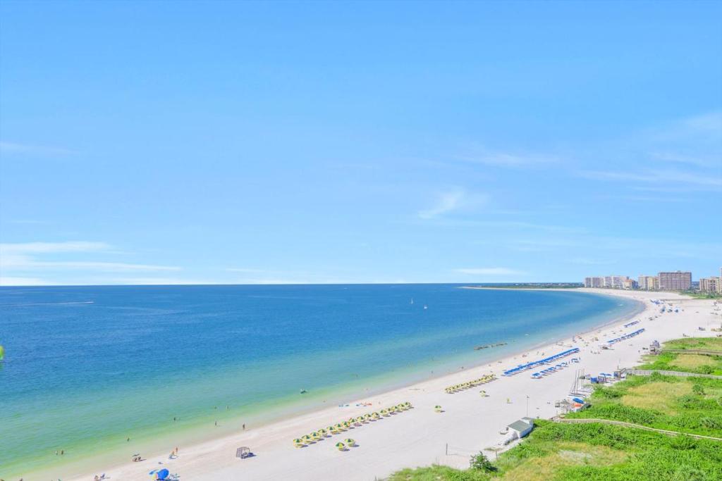 a view of a beach with people and the ocean at Sandcastle I-1201 in Marco Island