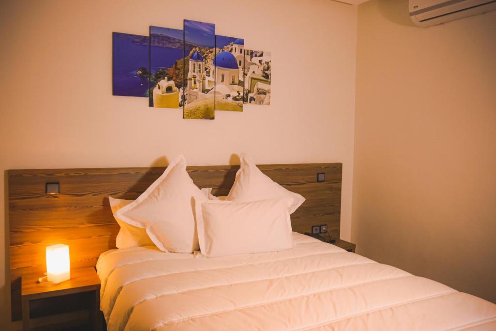 Postel nebo postele na pokoji v ubytování EL MOUSSAFIR HOTEL