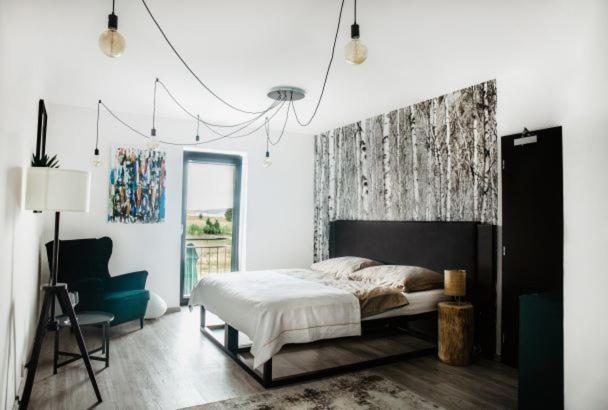Postel nebo postele na pokoji v ubytování Joy Aparthotel Keilberg