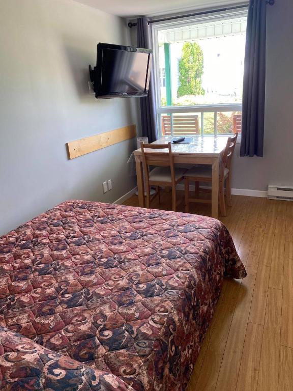 Postel nebo postele na pokoji v ubytování Chalets Glenn