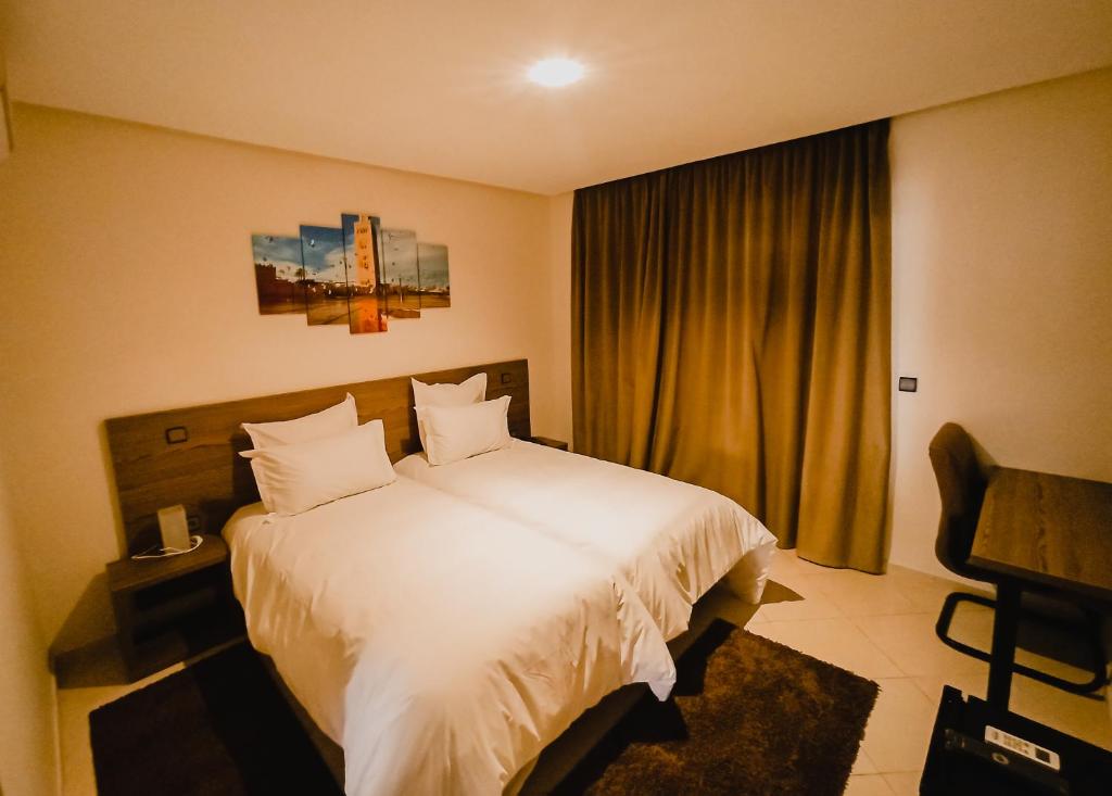 Postel nebo postele na pokoji v ubytování EL MOUSSAFIR HOTEL