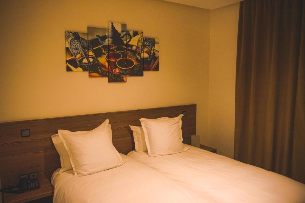 Postel nebo postele na pokoji v ubytování EL MOUSSAFIR HOTEL