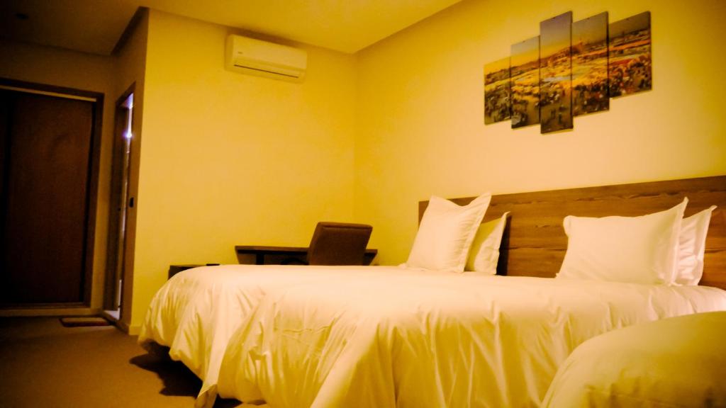 Postel nebo postele na pokoji v ubytování EL MOUSSAFIR HOTEL