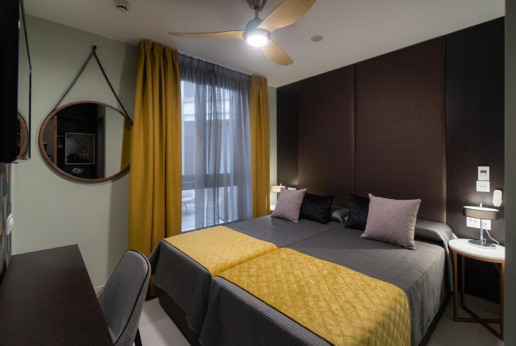 Postel nebo postele na pokoji v ubytování Hotel Perla del Sur