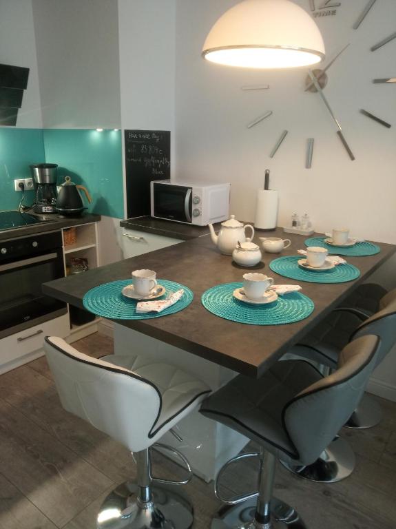 Kuchyňa alebo kuchynka v ubytovaní Przytulny apartament blisko Motławy i Neptuna z miejscem w garażu gratis