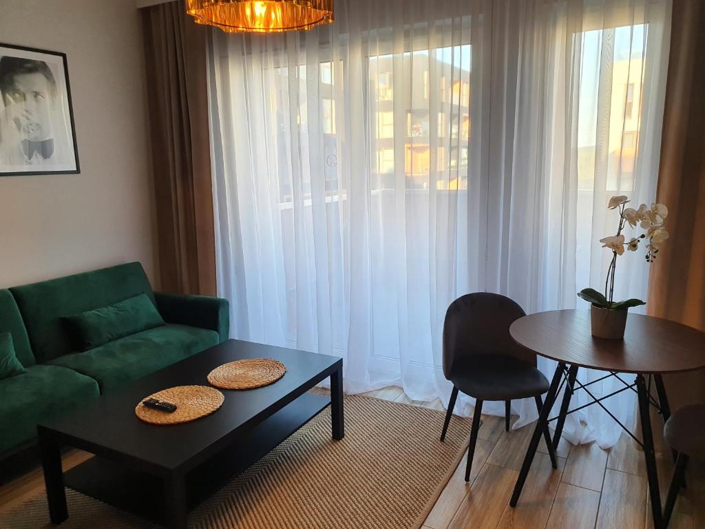 Posedenie v ubytovaní Apartamenty Ceglana Park -parking w hali garażowej- piękne nowe osiedle