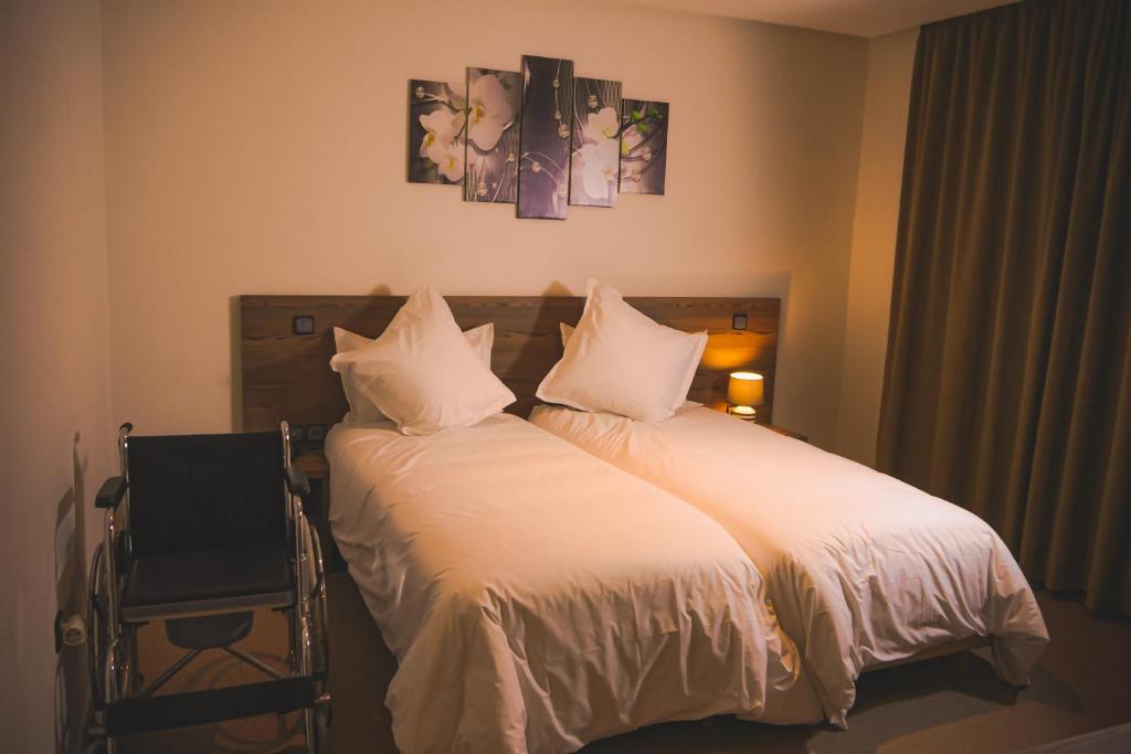 Postel nebo postele na pokoji v ubytování EL MOUSSAFIR HOTEL